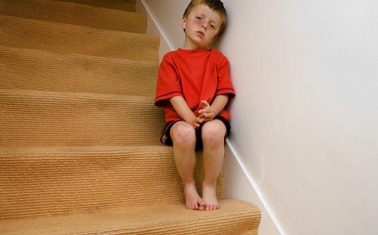 sad boy on staircase